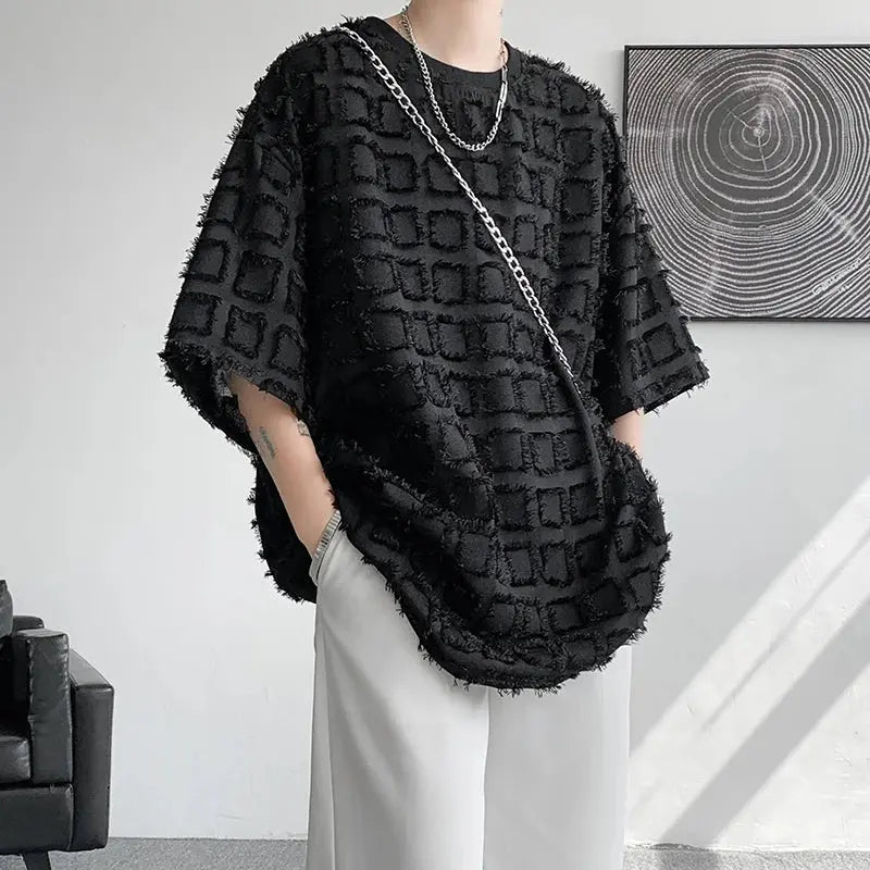 "T-shirt oversize nera con texture geometrica in rilievo" All You Need